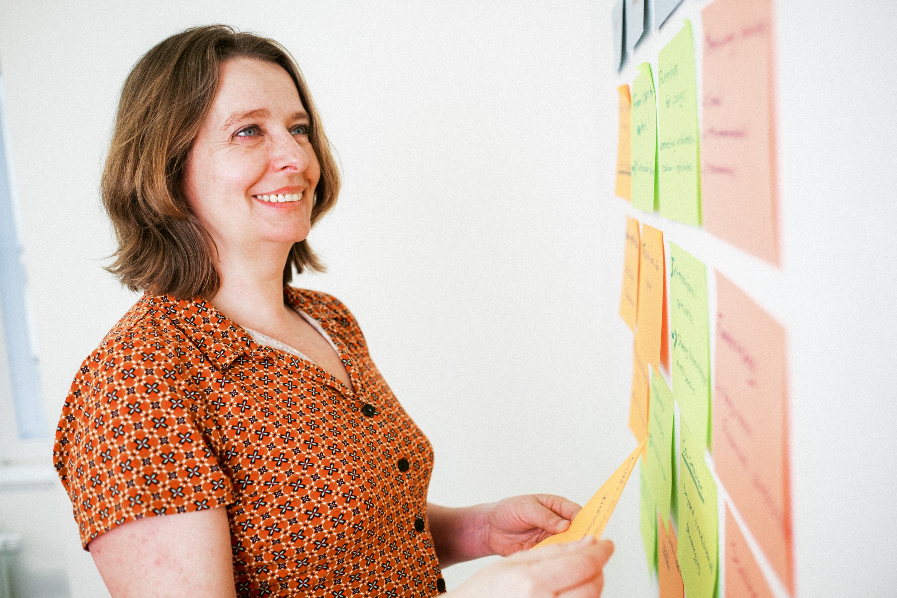 Stylized blue duotone portrait of a woman with long hair facing slightly backward