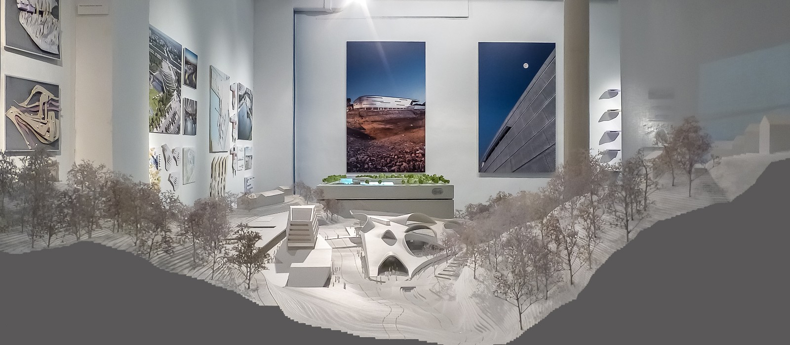 Abstracted user interface forecasting a 16% off target for 2027 emissions goal alongside an image of a mossy tree on top of a light blue gradient background