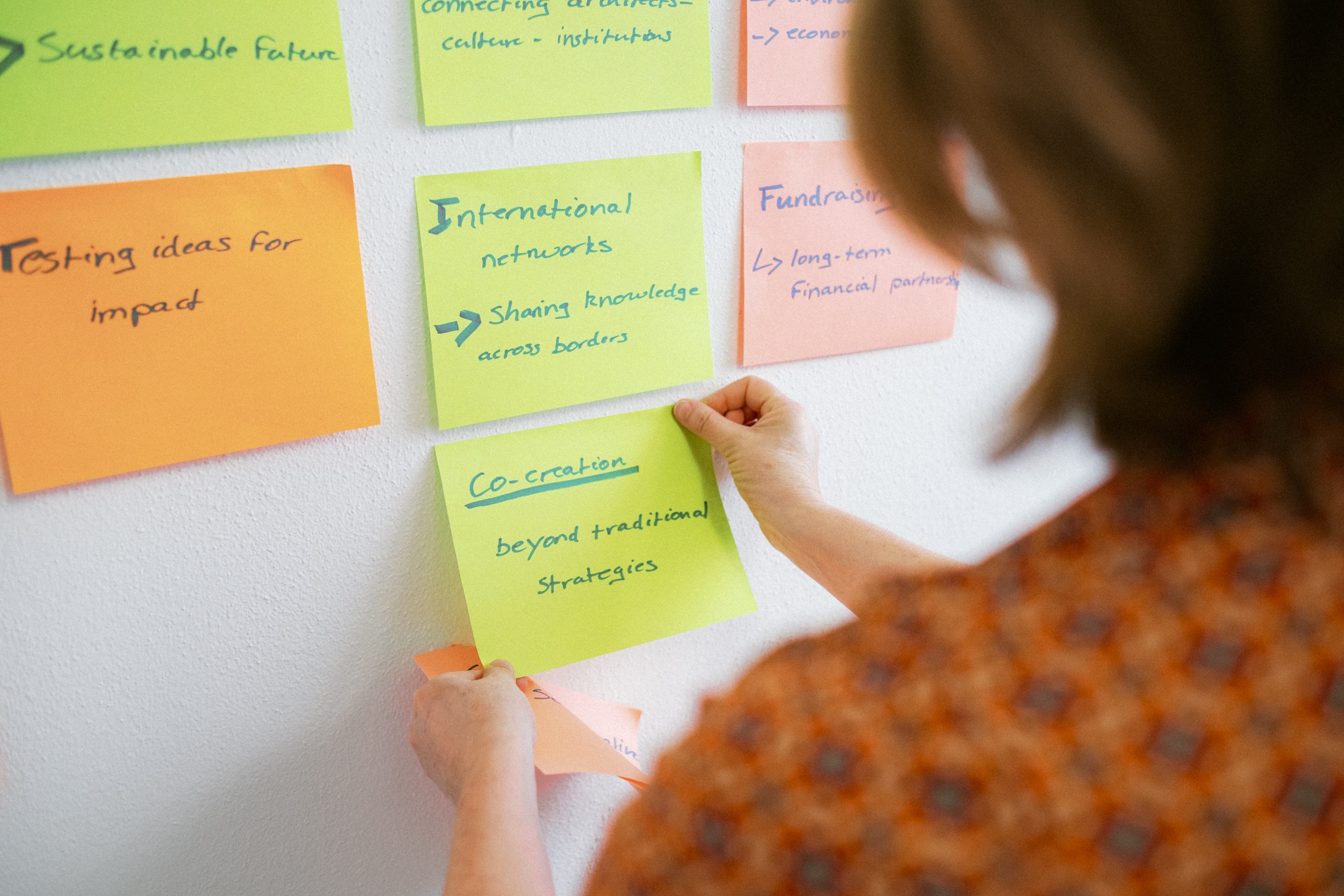 Stylized blue duotone portrait of a woman with long hair facing slightly backward