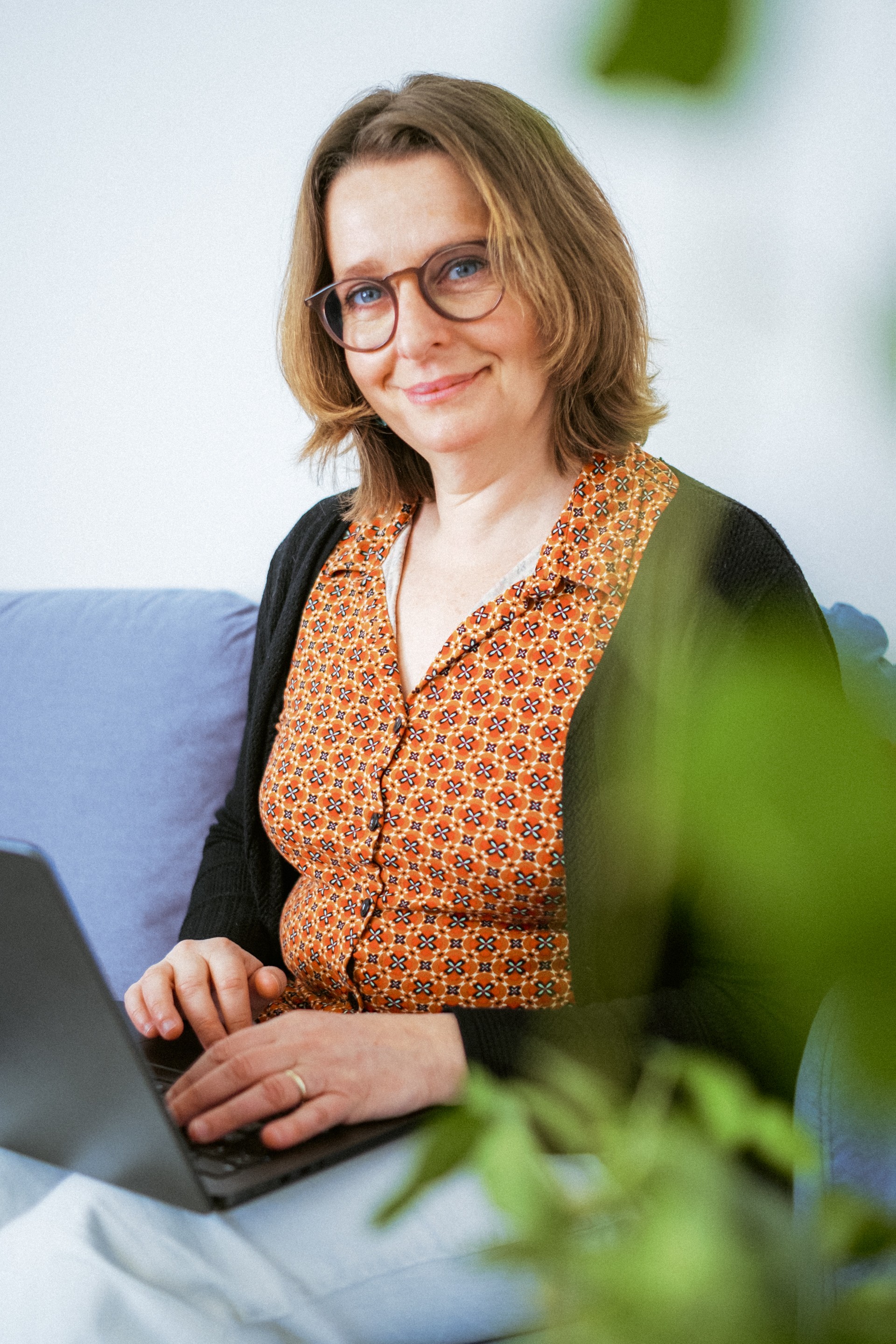 Stylized blue duotone portrait of a woman with long hair facing slightly backward